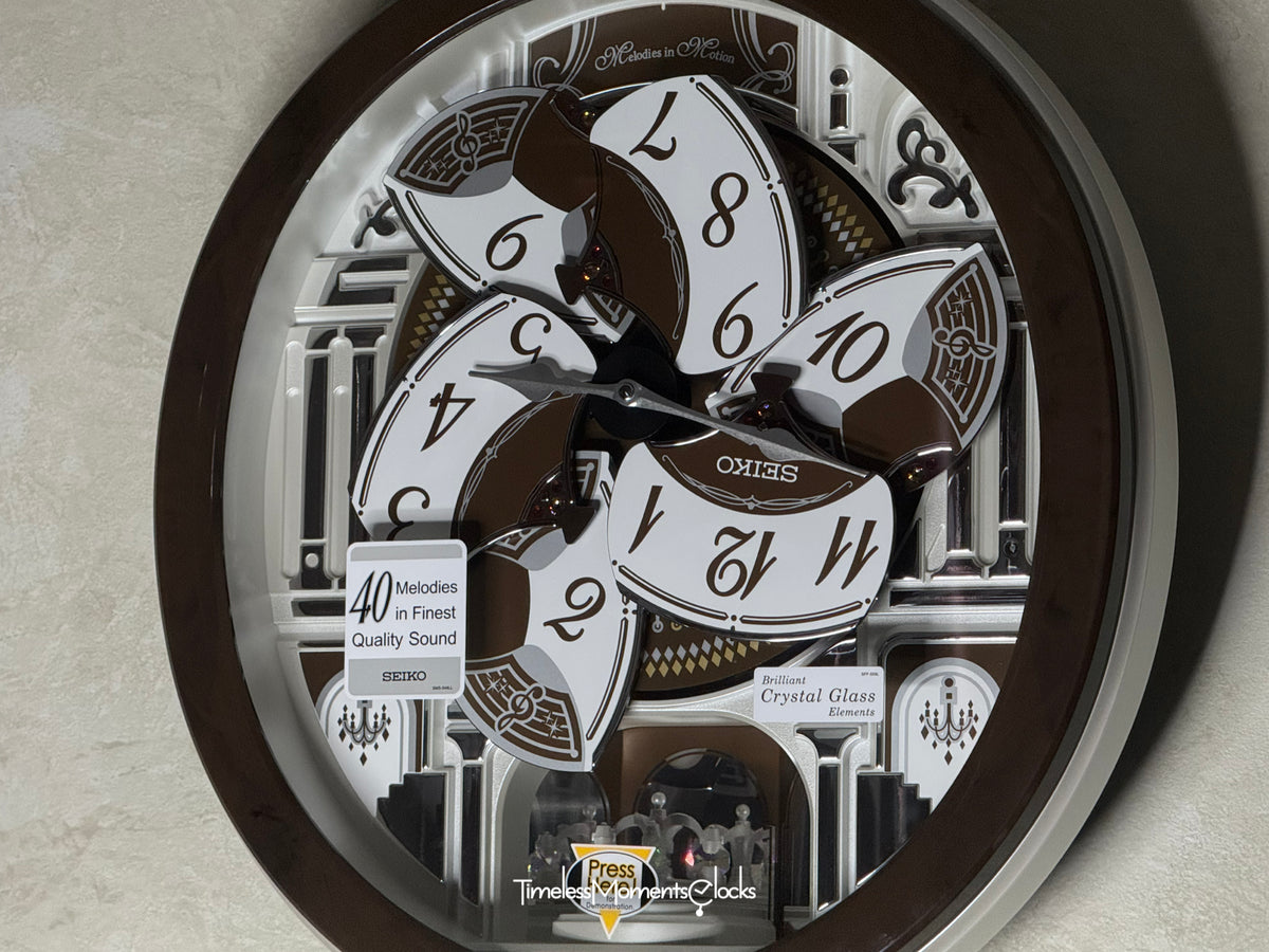 Seiko QXM615BRH “Snow Castle” Melodies in Motion Dancing Dial Musical Wall Clock with 40 Songs