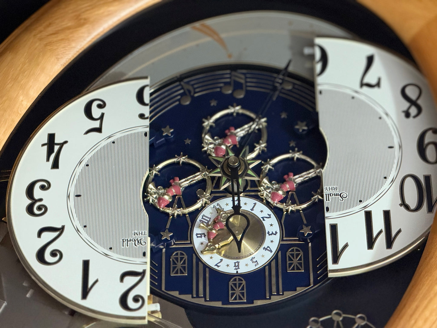 Rhythm "Timecracker Golden Oak" Moving Dial Magic Motion Musical Wooden Wall Clock with Popular Melodies - 4MH782-R07