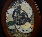 Rhythm "CTS Nostalgia" Moving Dial Magic Motion Musical Wooden Wall Clock with Popular Melodies - 4MH780-R06