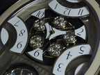Rhythm "Classic Brilliance" Moving Dial Magic Motion Musical Wall Clock - 4MH787PD18