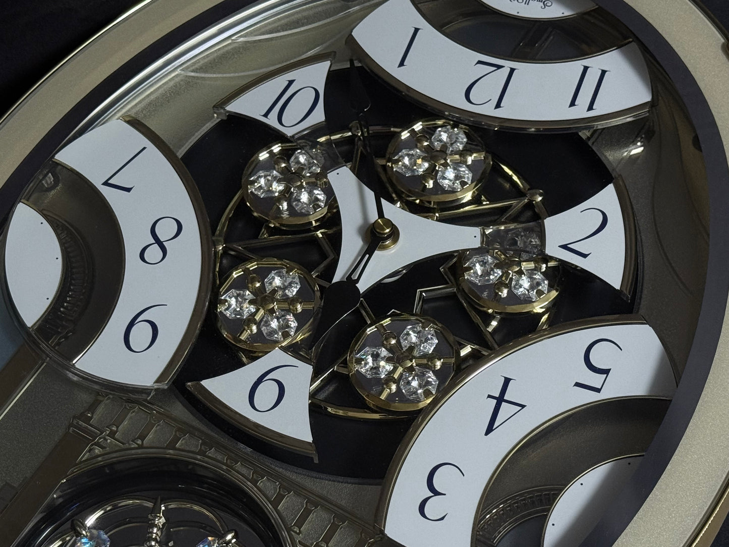 Rhythm "Classic Brilliance" Moving Dial Magic Motion Musical Wall Clock - 4MH787PD18