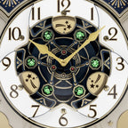 Seiko QXM378BRH “Castle Night” Melodies in Motion Dancing Dial Musical Wall Clock with 18 Songs
