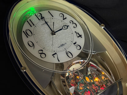 Citizen (Rhythm) "Pal Muse M482" Musical Motion Decorative Pendulum Wall Clock from Japan with LED Light Show - 4MN482-003