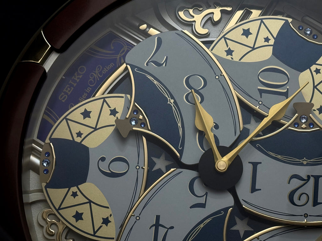 Seiko QXM356BRH "Golden Pillars" Melodies in Motion Dancing Dial Musical Wall Clock with 18 Songs