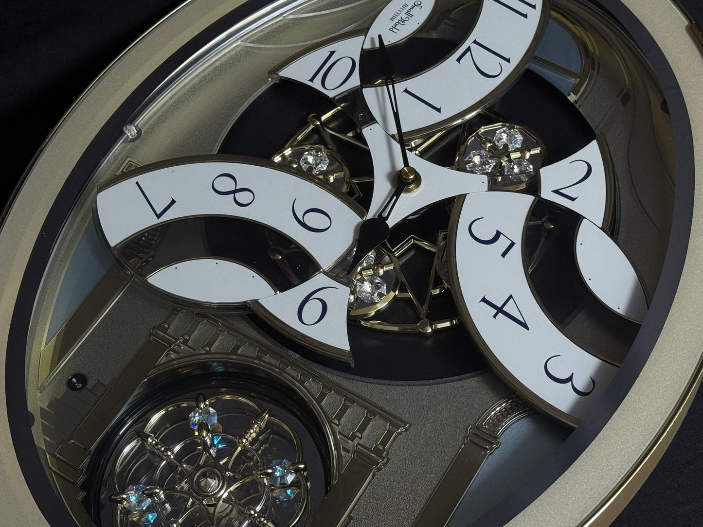 Rhythm "Classic Brilliance" Moving Dial Magic Motion Musical Wall Clock - 4MH787PD18