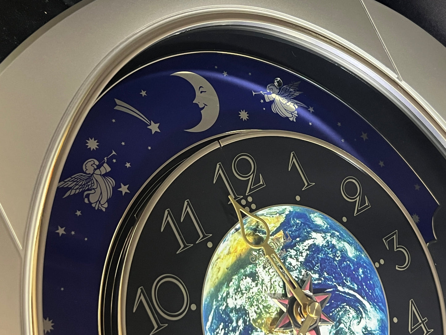 Rhythm “Peaceful Cosmos” Moving Earth Dial Magic Motion Musical Wall Clock with Popular Melodies - 4MH751AR19
