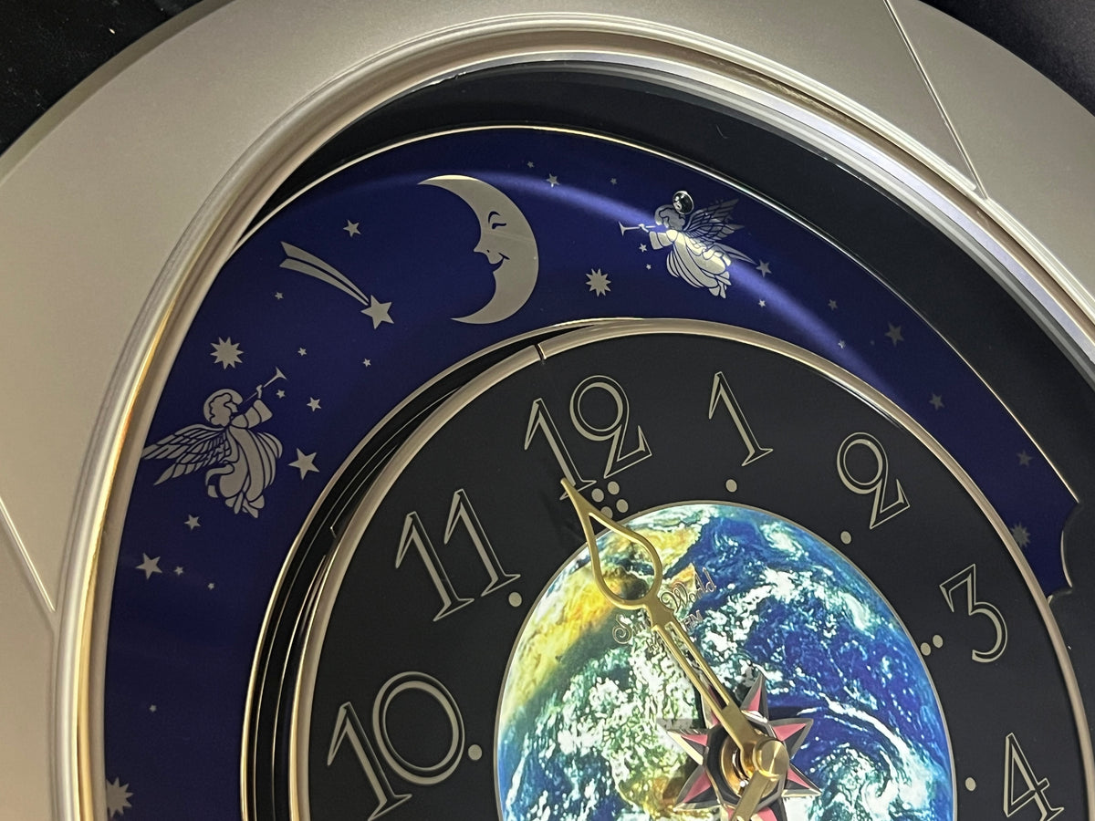 Rhythm “Peaceful Cosmos” Moving Earth Dial Magic Motion Musical Wall Clock with Popular Melodies - 4MH751AR19