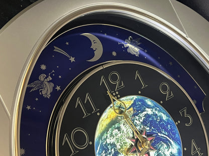 Rhythm “Peaceful Cosmos” Moving Earth Dial Magic Motion Musical Wall Clock with Popular Melodies - 4MH751AR19