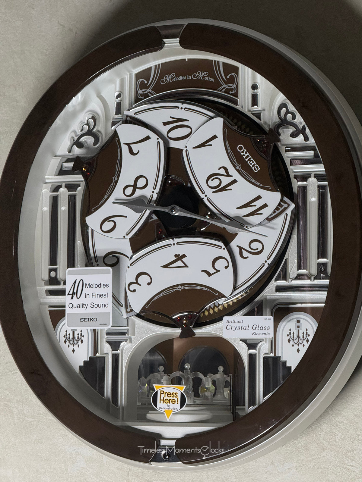 Seiko QXM615BRH “Snow Castle” Melodies in Motion Dancing Dial Musical Wall Clock with 40 Songs