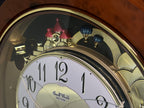 Rhythm "Woodgrain Stars" Moving Dial Magic Motion Musical Wall Clock - 4MH843WS23