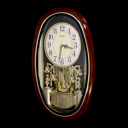 Rhythm "Golden Ringers" Magic Motion Musical Wall Clock with Animated Figurines - 4MH740NR23