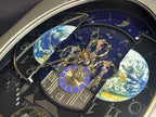 Rhythm “Peaceful Cosmos” Moving Earth Dial Magic Motion Musical Wall Clock with Popular Melodies - 4MH751AR19