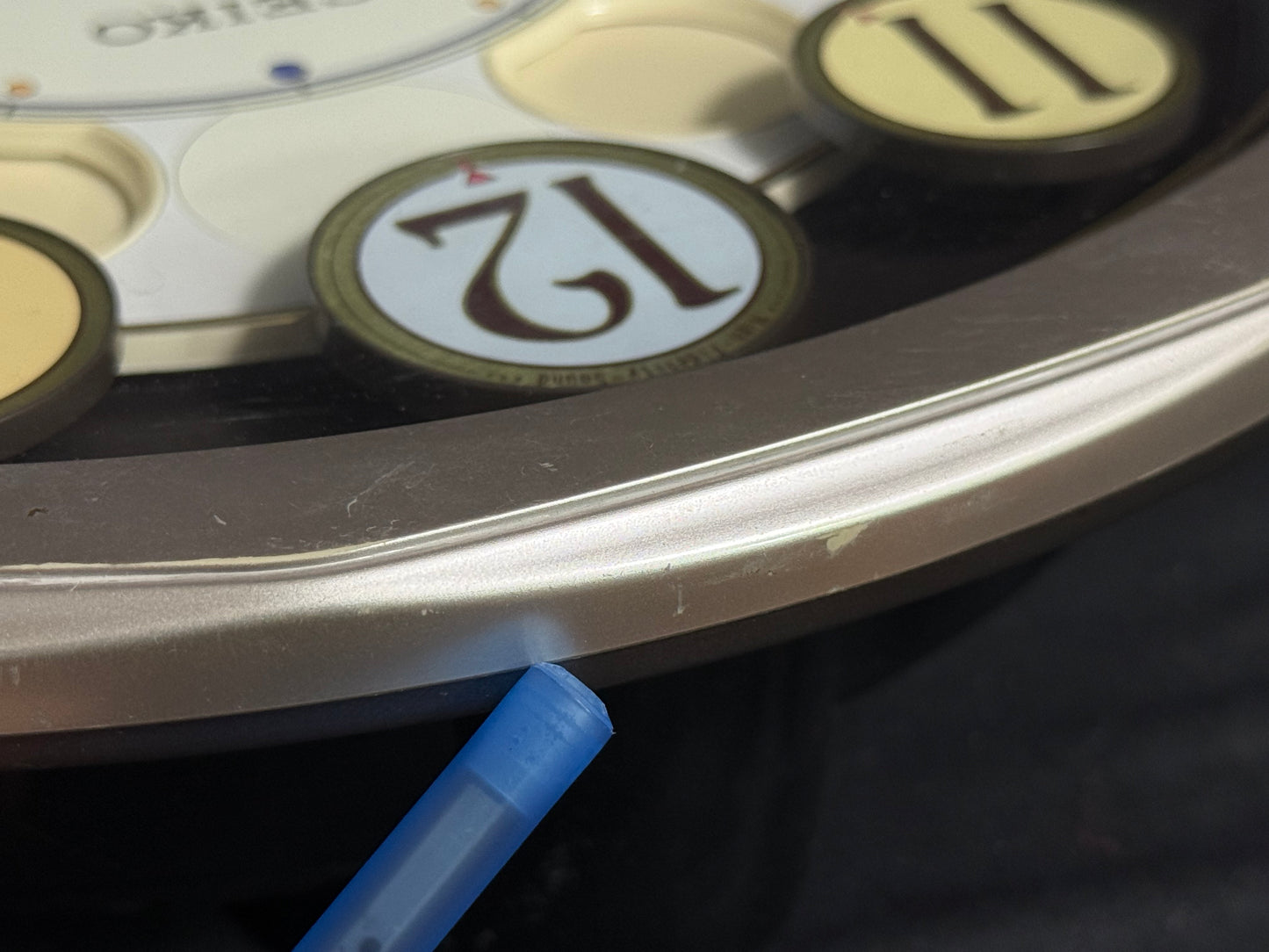 Seiko QXM106SRH "Twirling Numbers" Melodies in Motion Musical Wall Clock with Moving Dial