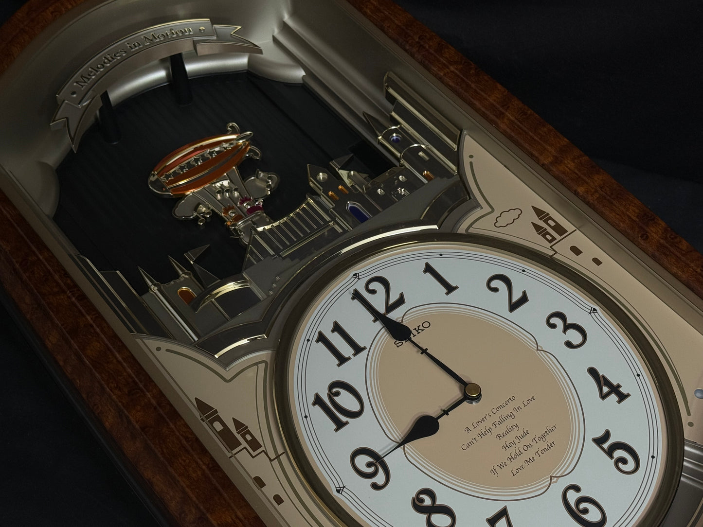 Seiko QXM135BRH "Lover’s Castle" Melodies in Motion Musical Moving Wall Clock with Popular Melodies