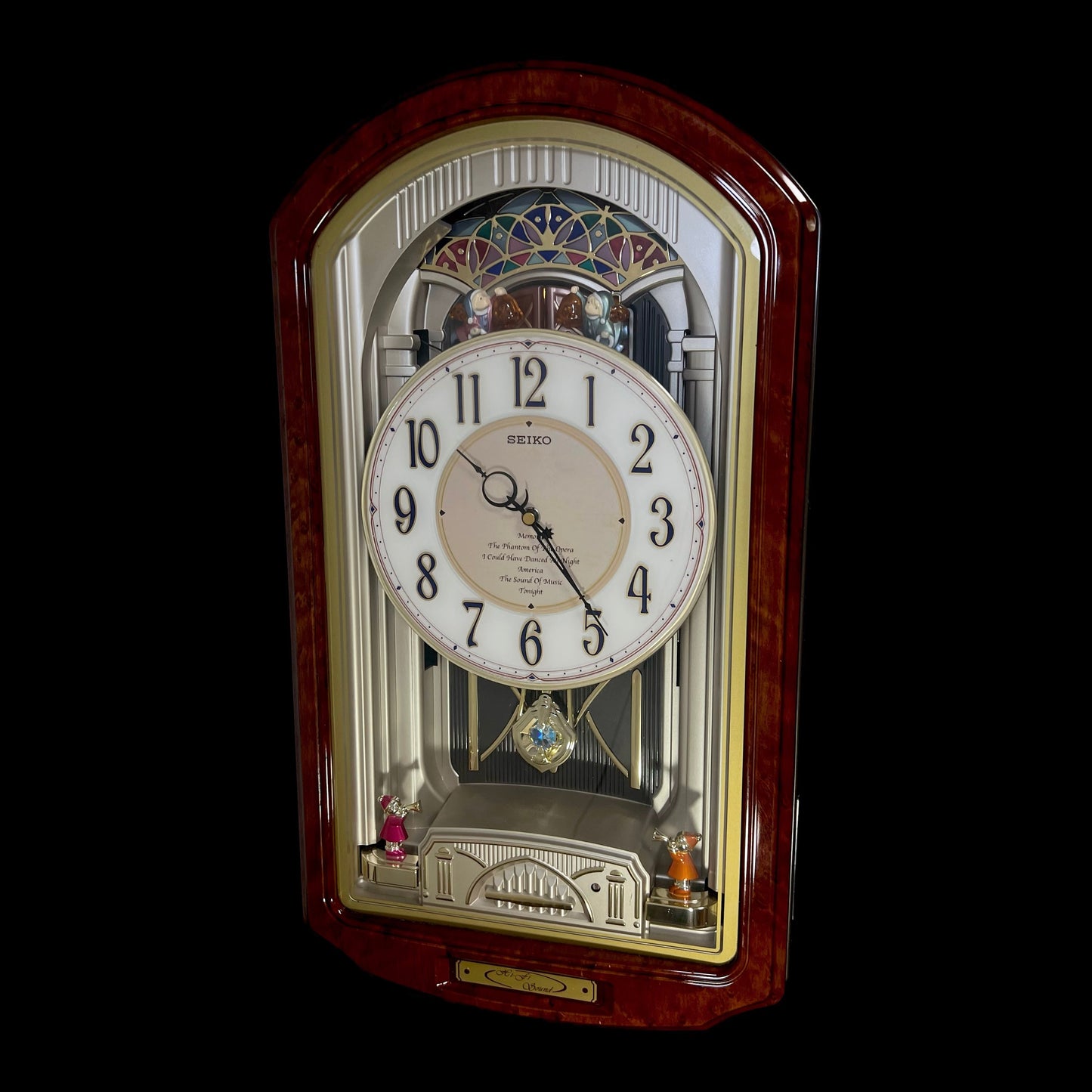 Seiko QXM123BRH "Broadway Showtunes Dropping Dial" Melodies in Motion Musical Moving Wall Clock with Popular Melodies