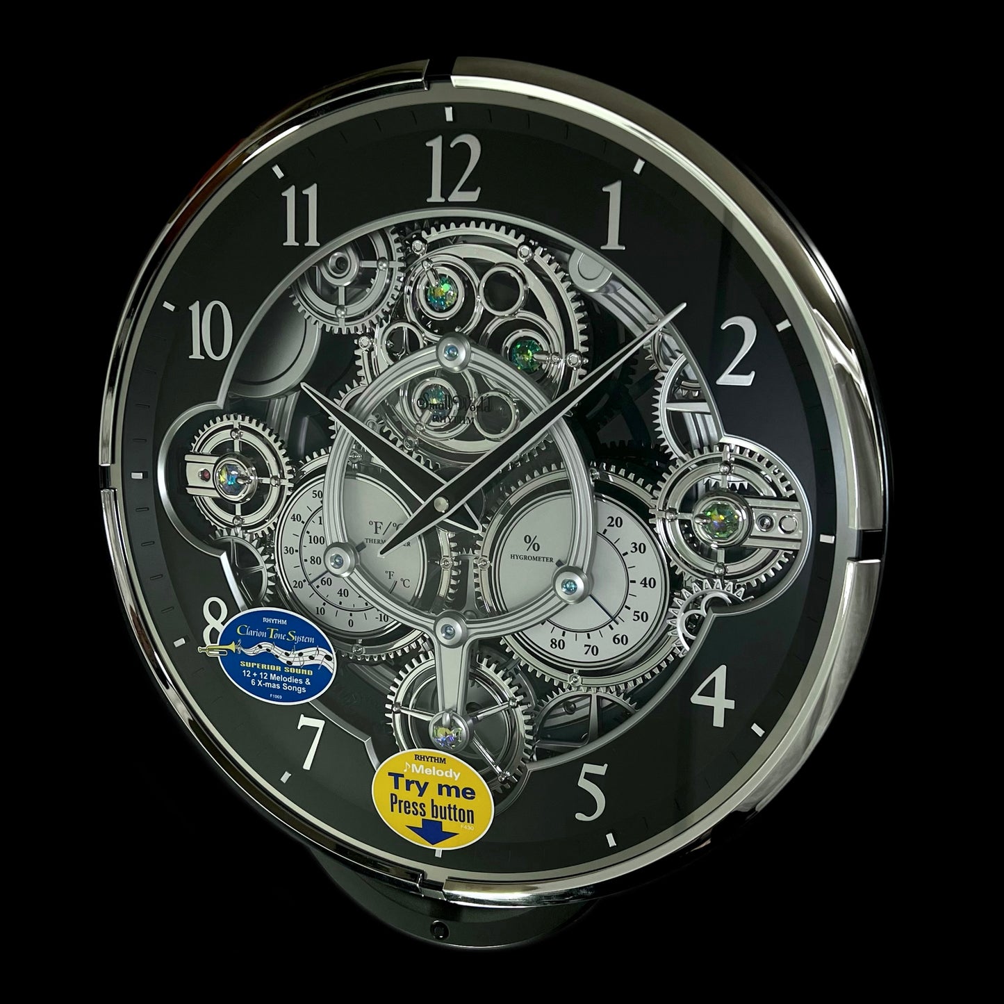 Rhythm “Chronograph (Black/Silver)” Skeletonized Dial Magic Motion Musical Wall Clock with Moving Gears - 4MH442WU08