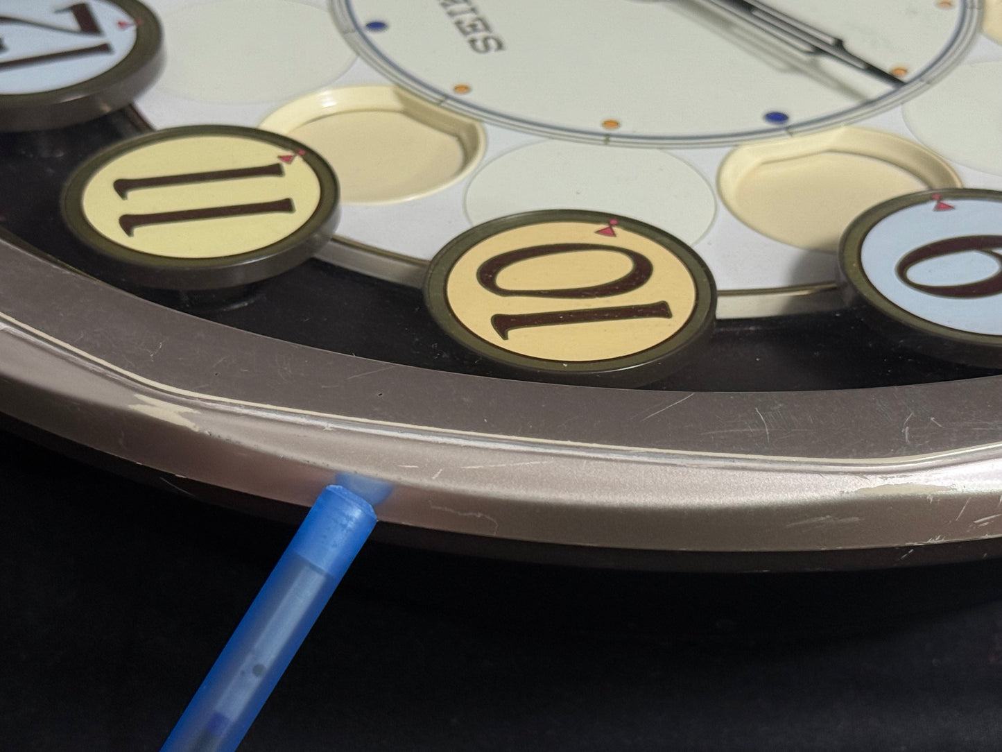 Seiko QXM106SRH "Twirling Numbers" Melodies in Motion Musical Wall Clock with Moving Dial