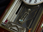 Seiko QXM123BRH "Broadway Showtunes Dropping Dial" Melodies in Motion Musical Moving Wall Clock with Popular Melodies