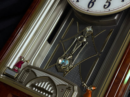 Seiko QXM123BRH "Broadway Showtunes Dropping Dial" Melodies in Motion Musical Moving Wall Clock with Popular Melodies