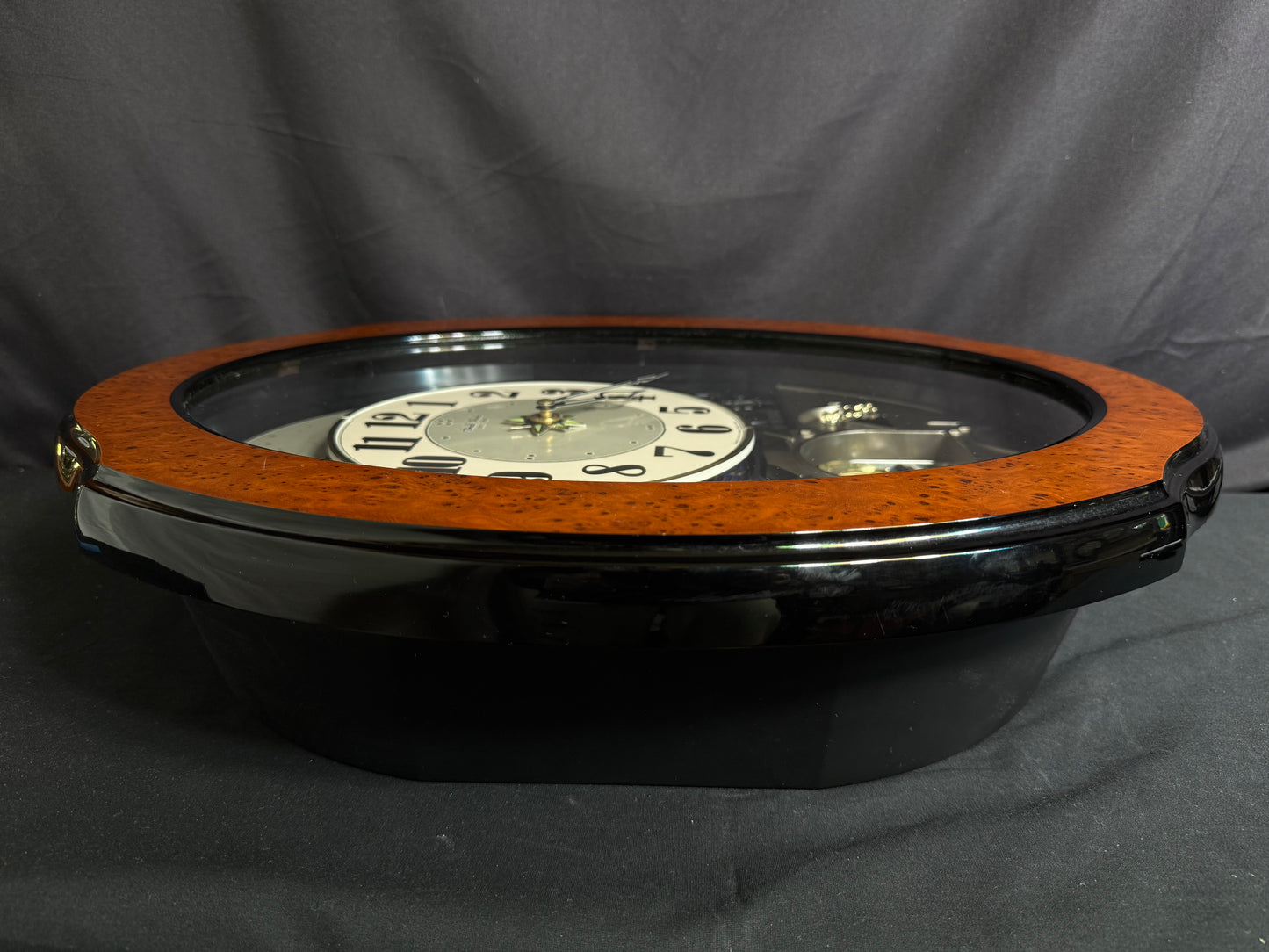Rhythm “DWS Timecracker” Moving Dial Magic Motion Musical Wooden Wall Clock with Popular Melodies - 4MH752-R06
