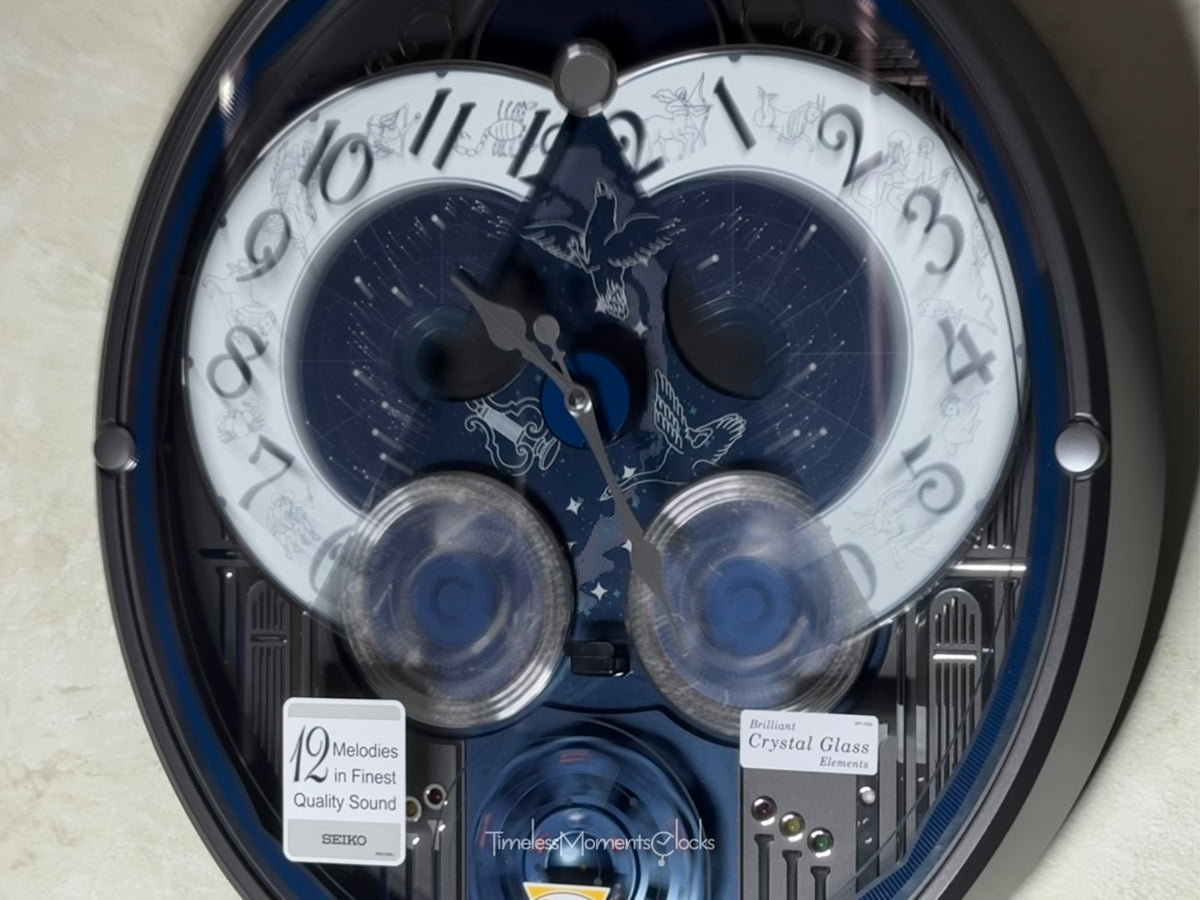 Seiko QXM393NRH “Galaxy Constellations” Astrology-Themed Melodies in Motion Moving Dial Musical Wall Clock with Luminous Dial & 12 Songs