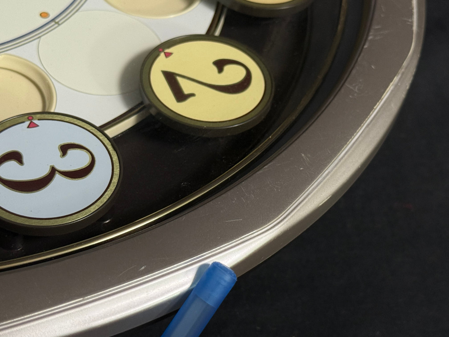 Seiko QXM106SRH "Twirling Numbers" Melodies in Motion Musical Wall Clock with Moving Dial