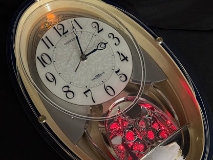 Citizen (Rhythm) "Pal Muse M482" Musical Motion Decorative Pendulum Wall Clock from Japan with LED Light Show - 4MN482-003