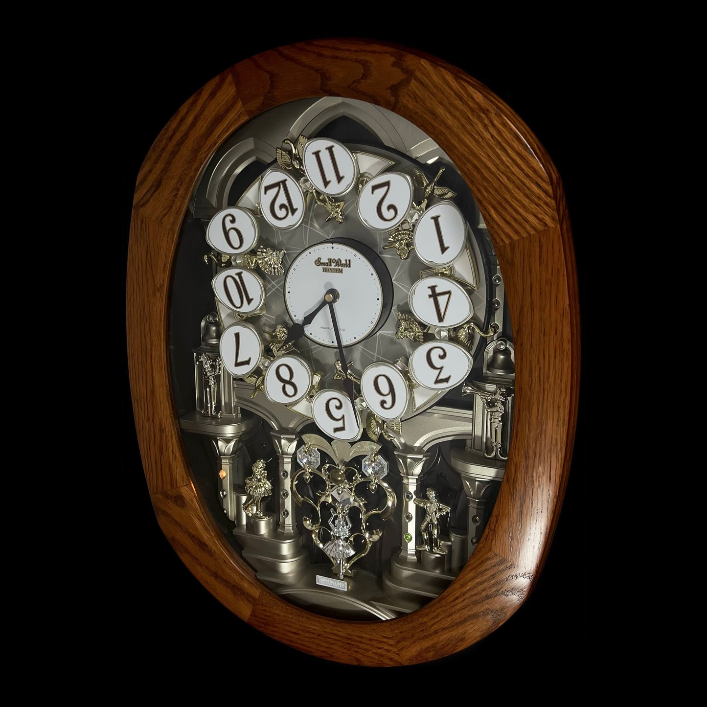 Rhythm "SSS Encore" Magic Motion Musical Wooden Wall Clock with Animated Moving Dial and Popular Melodies - 4MH810-R06