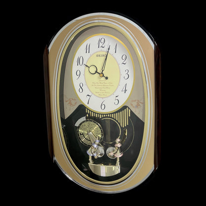 Seiko QXM124GRH "Music Disc Figurines" Melodies in Motion Musical Moving Wall Clock with Popular Music