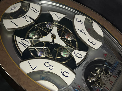 Rhythm “Tri-Cracker” Magic Motion Musical Wall Clock with Moving Dial and Balloons - 4MH759NR06