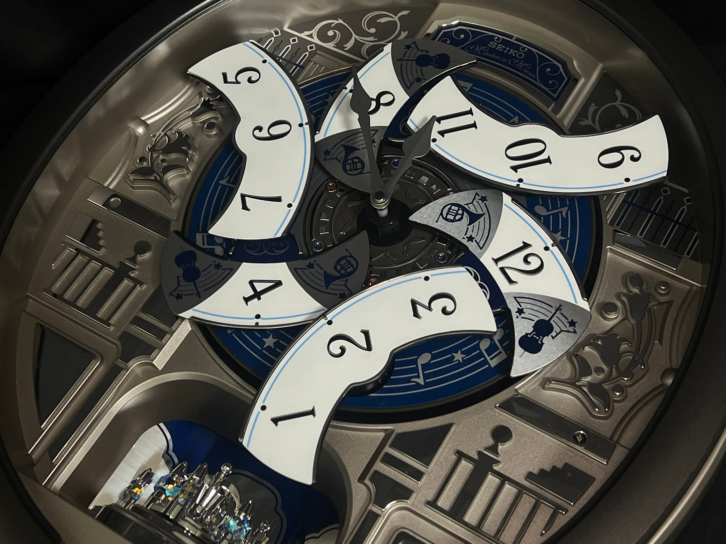 Seiko QXM366SRH “Musical Motifs” Melodies in Motion Dancing Dial Musical Wall Clock