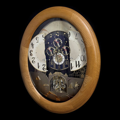 Rhythm "Timecracker Golden Oak" Moving Dial Magic Motion Musical Wooden Wall Clock with Popular Melodies - 4MH782-R07