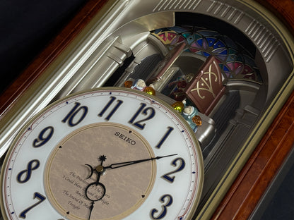 Seiko QXM123BRH "Broadway Showtunes Dropping Dial" Melodies in Motion Musical Moving Wall Clock with Popular Melodies