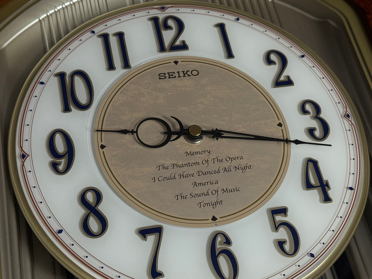 Seiko QXM123BRH "Broadway Showtunes Dropping Dial" Melodies in Motion Musical Moving Wall Clock with Popular Melodies