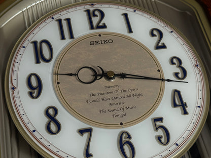 Seiko QXM123BRH "Broadway Showtunes Dropping Dial" Melodies in Motion Musical Moving Wall Clock with Popular Melodies