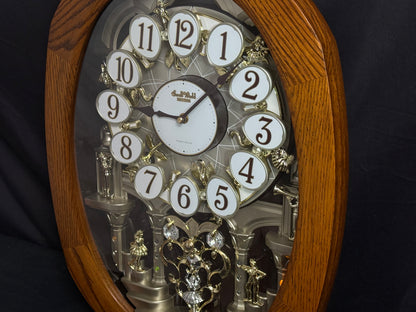 Rhythm "SSS Encore" Magic Motion Musical Wooden Wall Clock with Animated Moving Dial and Popular Melodies - 4MH810-R06