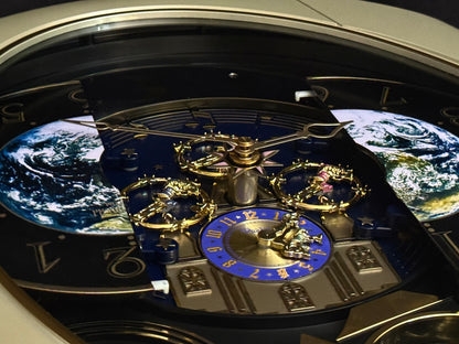 Rhythm “Peaceful Cosmos Entertainer” Moving Earth Dial Magic Motion Musical Wall Clock with Popular Melodies - 4MH839WB19