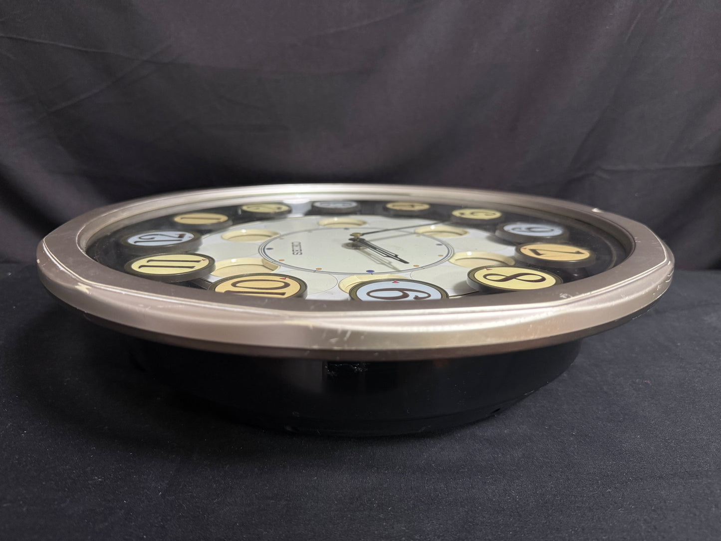 Seiko QXM106SRH "Twirling Numbers" Melodies in Motion Musical Wall Clock with Moving Dial