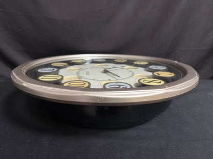 Seiko QXM106SRH "Twirling Numbers" Melodies in Motion Musical Wall Clock with Moving Dial