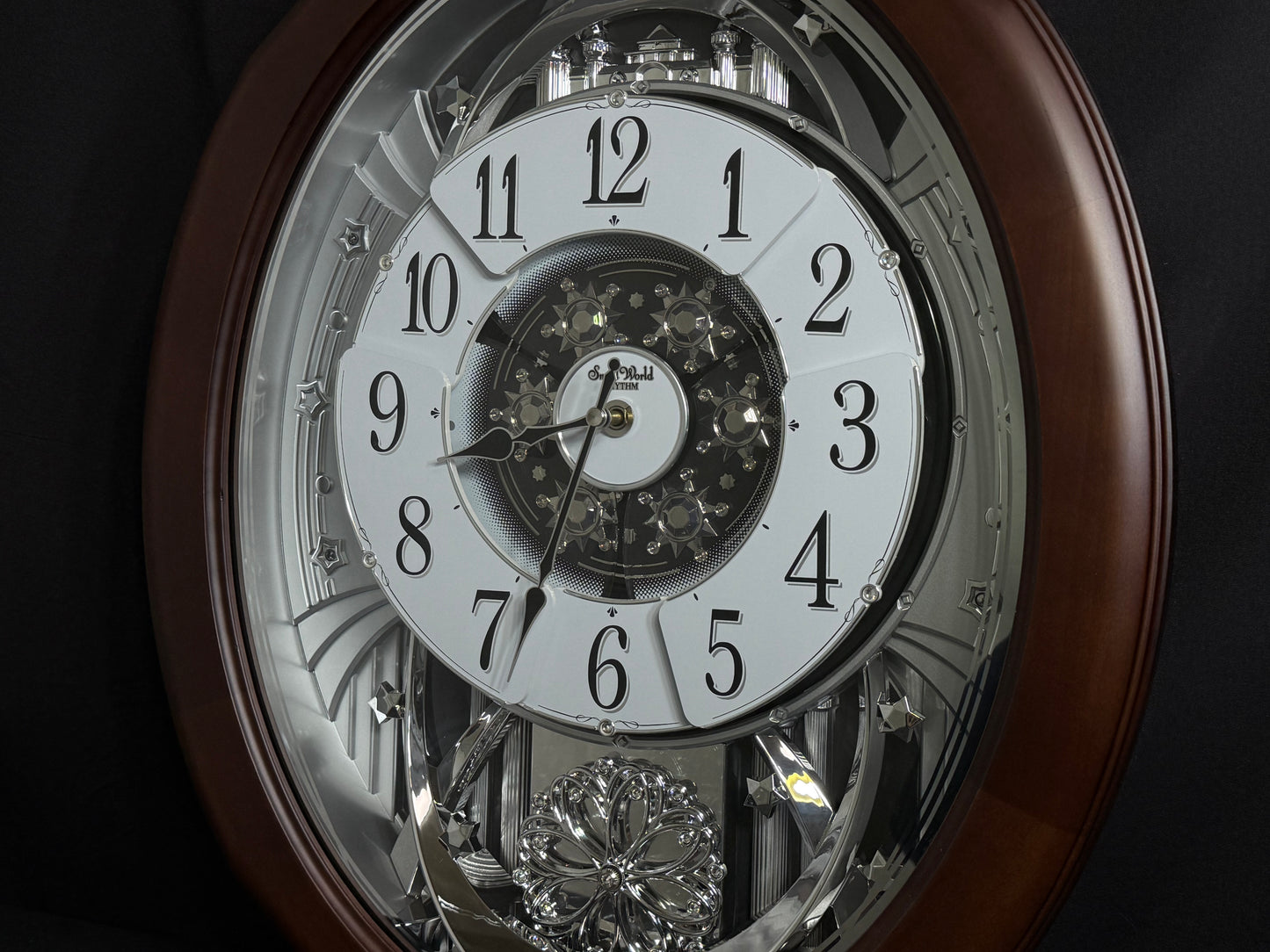 Rhythm "Anthology Espresso" Magic Motion Musical Wooden Wall Clock with Moving Dial - 4MH869WU06