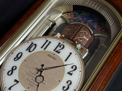 Seiko QXM123BRH "Broadway Showtunes Dropping Dial" Melodies in Motion Musical Moving Wall Clock with Popular Melodies