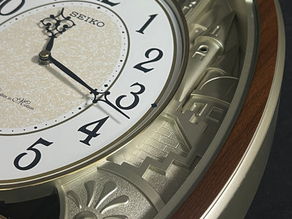 Seiko QXM369BRH “Golden Citadel” Melodies in Motion Musical Decorative Pendulum Wall Clock
