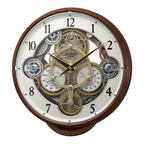 Rhythm “Widget (Woodgrain)” Skeletonized Dial Magic Motion Musical Wall Clock with Moving Gears - 4MH886WU23