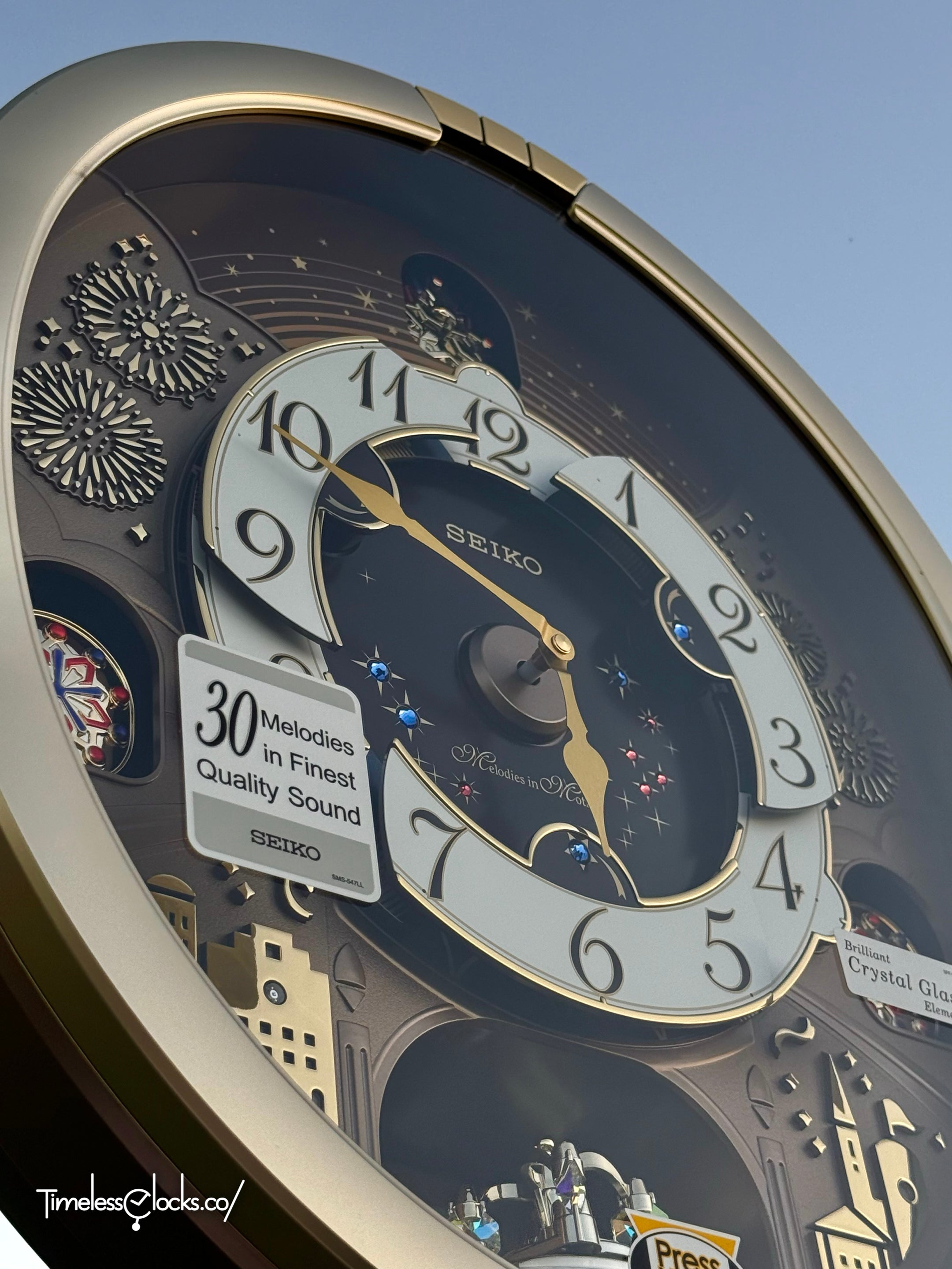 Seiko QXM620GRH "Golden Festival" Melodies in Motion Dancing Dial Musical Wall Clock with 30 Songs