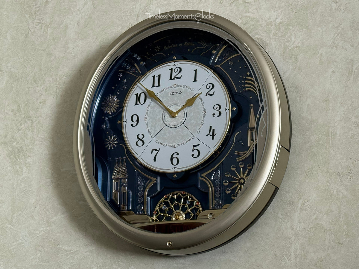 Seiko QXM239SRH "Celebration" Melodies in Motion Musical Wall Clock with Animated Moving Dial & 6 Songs