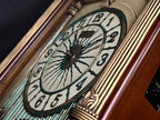 Rhythm “CTS Sundial” Gothic Wooden Musical Motion Pendulum Wall Clock with Popular Melodies - CMJ336UR06