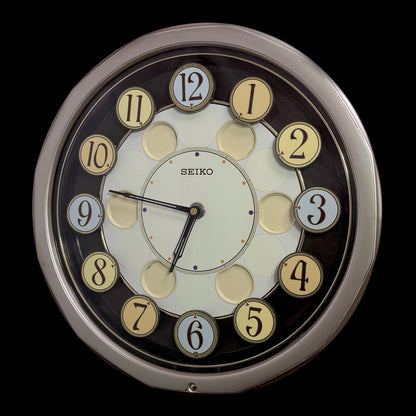 Seiko QXM106SRH "Twirling Numbers" Melodies in Motion Musical Wall Clock with Moving Dial