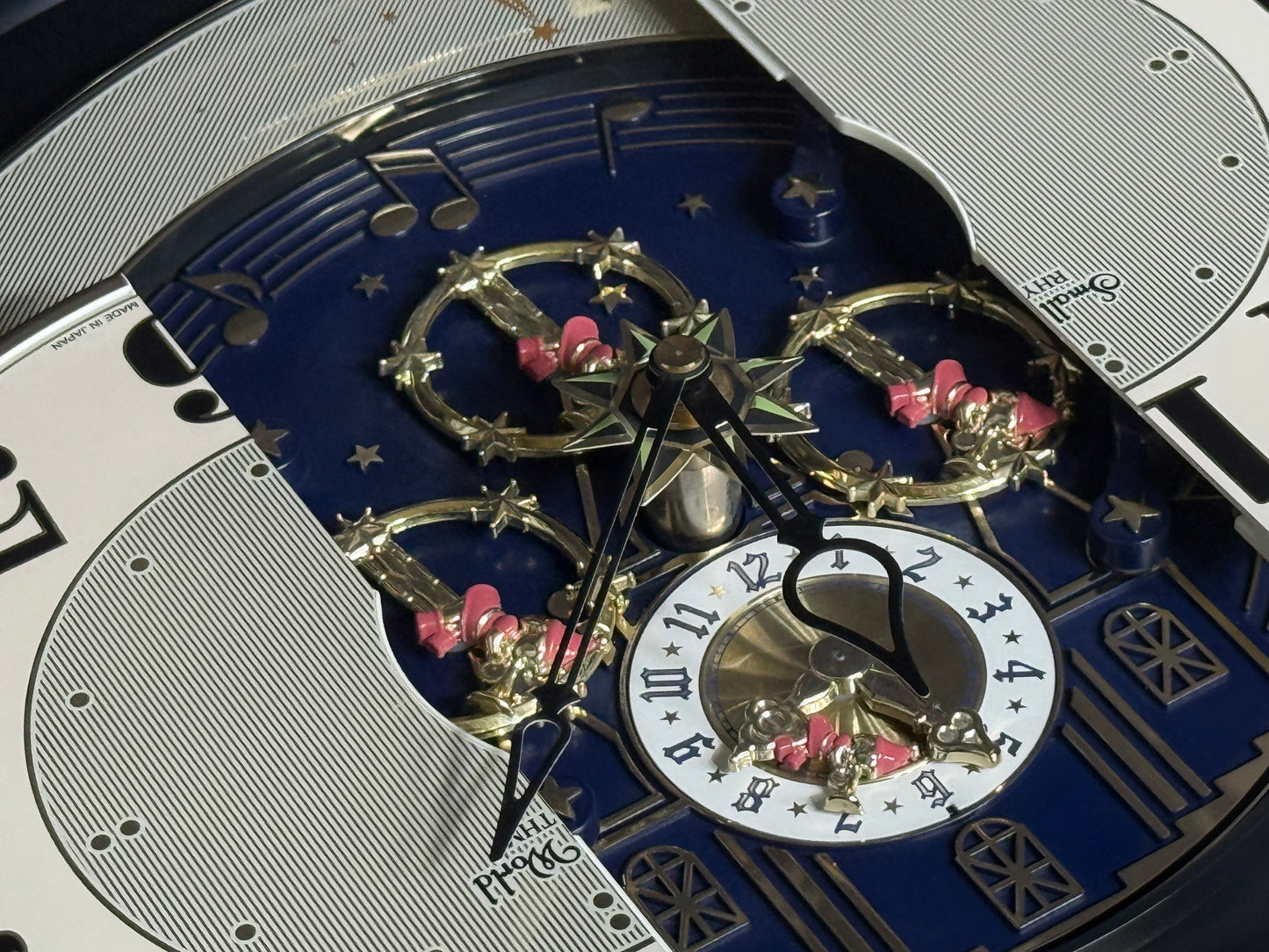 Rhythm “DWS Timecracker” Moving Dial Magic Motion Musical Wooden Wall Clock with Popular Melodies - 4MH752-R06