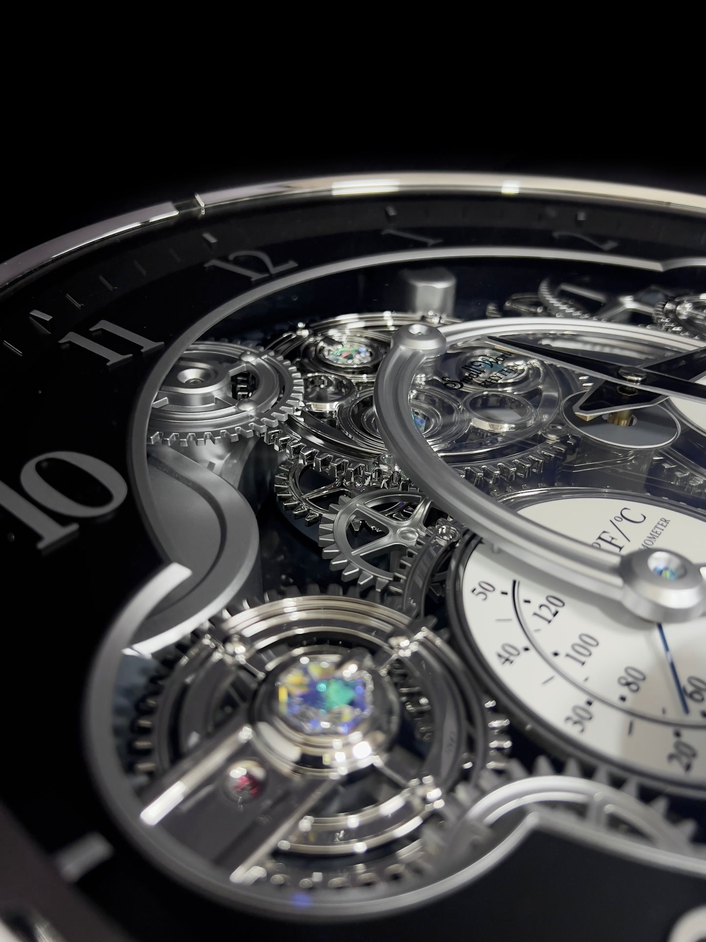 Rhythm “Chronograph (Black/Silver)” Skeletonized Dial Magic Motion Musical Wall Clock with Moving Gears - 4MH442WU08