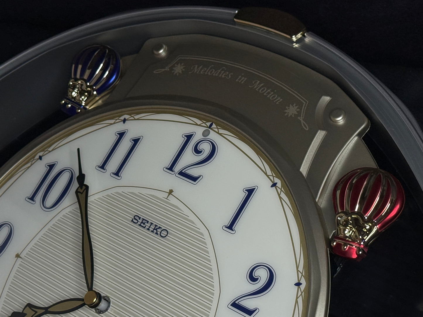 Seiko QXM155SRH "Twinkling Stars" Melodies in Motion Musical Decorative Pendulum Wall Clock with Popular Music